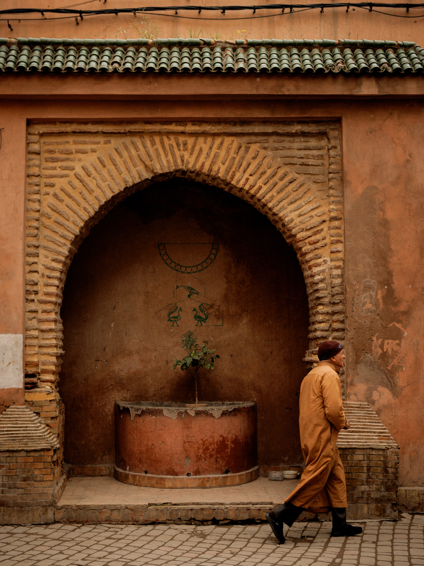 Moroccan man walking in the marrakech medina